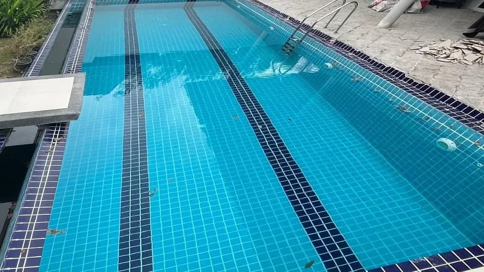 Lap pool with lane lines before renovation