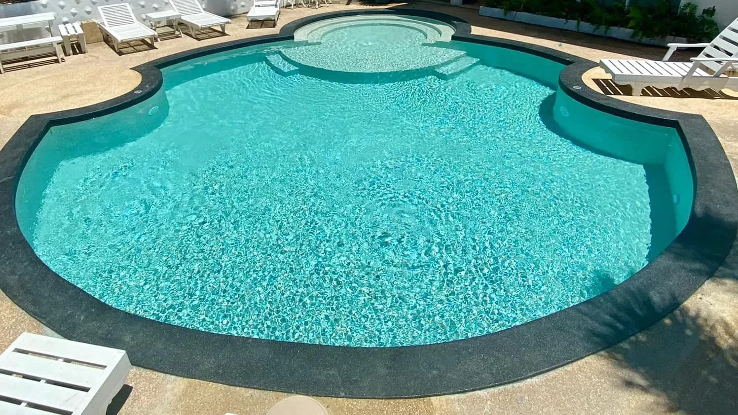 Scalloped pool and spa after renovation