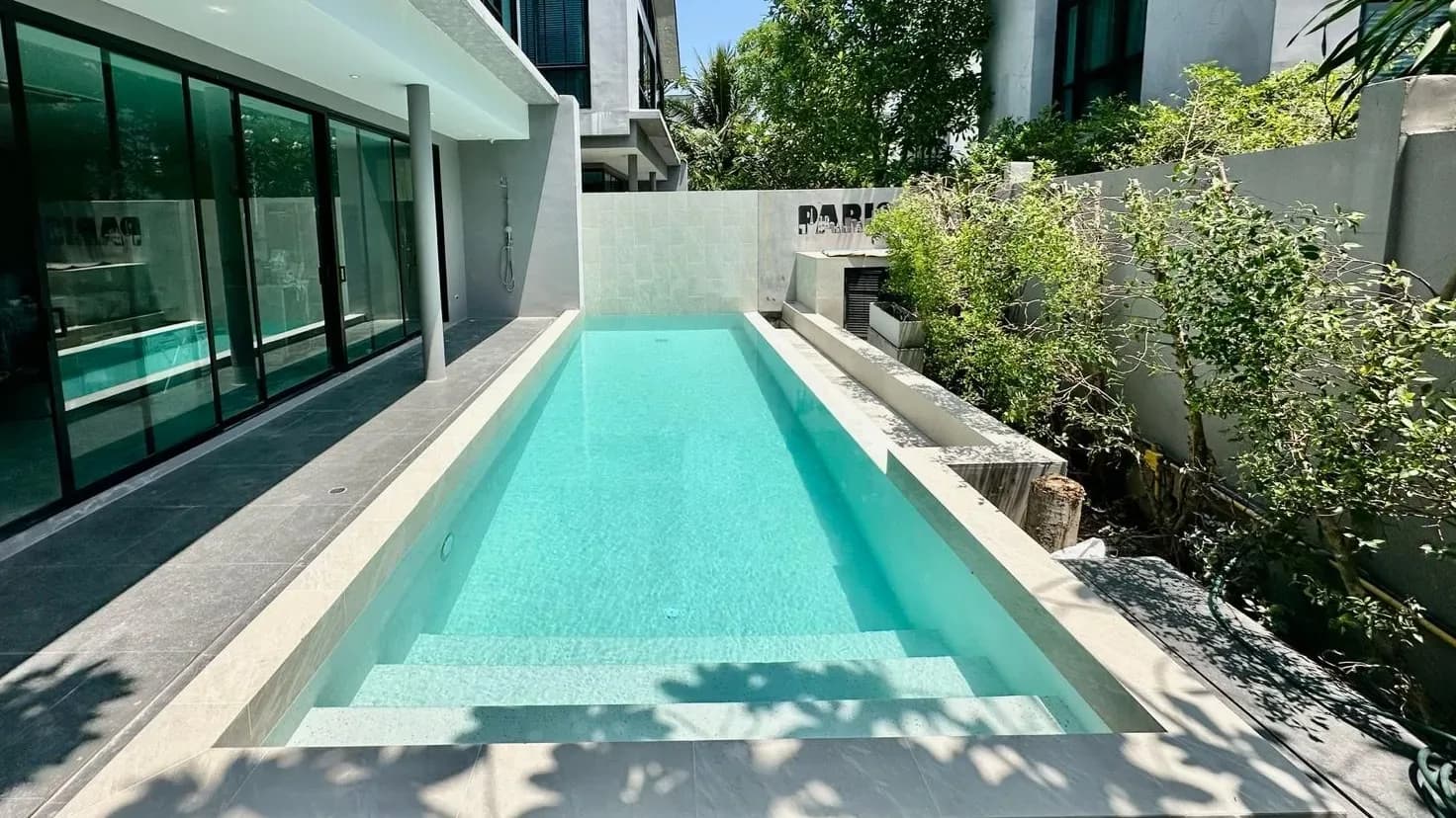 Side-garden lap pool after renovation
